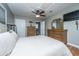 Cozy bedroom featuring wood flooring, neutral walls, ceiling fan, and ensuite bathroom at 240 Horseshoe Dr, Goose Creek, SC 29445