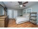 Bright bedroom with wood floors, ceiling fan, two large windows, and neutral walls at 240 Horseshoe Dr, Goose Creek, SC 29445