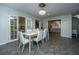 Dining room with french doors to patio, dining table with seating and view into kitchen at 240 Horseshoe Dr, Goose Creek, SC 29445