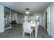 Open concept dining room includes table with seating, spiral staircase, and access to backyard at 240 Horseshoe Dr, Goose Creek, SC 29445