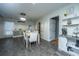 Bright dining room with a modern table set, decorative shelving, and tile flooring at 240 Horseshoe Dr, Goose Creek, SC 29445