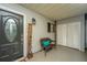 Inviting front porch features a welcome sign, a cozy chair, and tile flooring at 240 Horseshoe Dr, Goose Creek, SC 29445