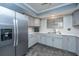 Updated kitchen boasts stainless steel appliances, sleek countertops, and ample cabinet space at 240 Horseshoe Dr, Goose Creek, SC 29445