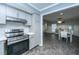 Open kitchen showcases modern appliances and transitions seamlessly into the dining area at 240 Horseshoe Dr, Goose Creek, SC 29445