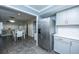 Modern kitchen features stainless steel refrigerator, gray cabinets, and an eat-in kitchen with a dining room at 240 Horseshoe Dr, Goose Creek, SC 29445