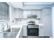 Contemporary kitchen with stainless steel oven, bright countertops, and stylish gray cabinetry at 240 Horseshoe Dr, Goose Creek, SC 29445