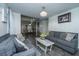 Open concept living room with spiral staircase, neutral decor, and a view to the dining area at 240 Horseshoe Dr, Goose Creek, SC 29445