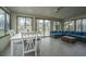 Bright sun room with tile flooring, table, and comfortable wicker seating; excellent for enjoying the outdoors inside at 240 Horseshoe Dr, Goose Creek, SC 29445