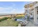 Coastal backyard with ocean view and lounge seating at 3001 Marshall Blvd, Sullivans Island, SC 29482