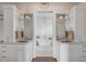 Elegant bathroom with dual vanities, a standalone soaking tub and stylish tile flooring at 3001 Marshall Blvd, Sullivans Island, SC 29482
