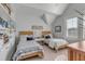 Charming bedroom with twin beds, built-in shelving and a light, airy feel at 3001 Marshall Blvd, Sullivans Island, SC 29482