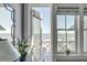 Bedroom with a door opening to a balcony with beautiful ocean views and natural light at 3001 Marshall Blvd, Sullivans Island, SC 29482