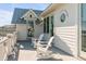Stunning outdoor deck with white Adirondack chairs and beach views at 3001 Marshall Blvd, Sullivans Island, SC 29482