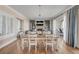 Elegant dining room with hardwood floors, a stylish table set, and seamless access to the living area at 3001 Marshall Blvd, Sullivans Island, SC 29482