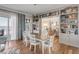 Open dining room with beautiful ocean views, built-in shelving, and access to a beachfront balcony at 3001 Marshall Blvd, Sullivans Island, SC 29482