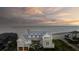 Luxury beachfront home boasting multiple decks with panoramic ocean views and private beach access at 3001 Marshall Blvd, Sullivans Island, SC 29482