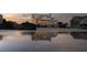 Beautiful oceanfront home reflected in the water, featuring multiple decks for enjoying beach views at 3001 Marshall Blvd, Sullivans Island, SC 29482