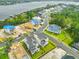 Aerial view of neighborhood featuring beautiful homes, lush landscaping, and waterfront access at 325 Blowing Fresh Dr, Charleston, SC 29492