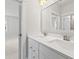 Elegant bathroom featuring double vanity, white cabinets, large mirror, and modern lighting at 325 Blowing Fresh Dr, Charleston, SC 29492