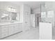 Bright bathroom boasting walk-in closets, glass shower, double vanity, and neutral colors at 325 Blowing Fresh Dr, Charleston, SC 29492