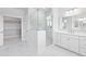 Bright white bathroom featuring glass shower, double vanity, and walk-in closet at 325 Blowing Fresh Dr, Charleston, SC 29492