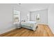 Comfortable bedroom with natural light, featuring wood floors and decorative flamingo accents at 325 Blowing Fresh Dr, Charleston, SC 29492