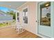 Inviting front porch with rocking chairs, offering a relaxing space with views of the neighborhood at 325 Blowing Fresh Dr, Charleston, SC 29492