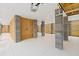 Large covered parking features concrete pillars, enclosed storage area, and garage door access at 325 Blowing Fresh Dr, Charleston, SC 29492