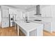 Bright kitchen featuring white cabinets, stainless steel appliances, and a large center island at 325 Blowing Fresh Dr, Charleston, SC 29492