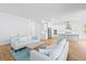 Inviting living room with hardwood floors and comfortable seating, open to a modern kitchen at 325 Blowing Fresh Dr, Charleston, SC 29492