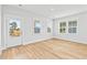 Bright and airy living room with wood floors and views of the lake at 325 Blowing Fresh Dr, Charleston, SC 29492