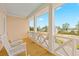 Charming porch with rocking chairs and scenic views at 325 Blowing Fresh Dr, Charleston, SC 29492