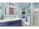Charming bathroom with a white vanity, light blue walls, and a glass shower at 3271 Johnstowne St, Johns Island, SC 29455