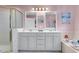 Bathroom featuring a double vanity, soaking tub, and tiled shower with glass door at 3271 Johnstowne St, Johns Island, SC 29455