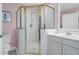 Shower with glass doors and updated vanity at 3271 Johnstowne St, Johns Island, SC 29455