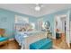 This bedroom features a white wood bed frame and beachy decor at 3271 Johnstowne St, Johns Island, SC 29455