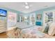 Comfortable bedroom with ocean themed bedspread and view of the bathroom and natural light at 3271 Johnstowne St, Johns Island, SC 29455