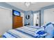 Comfortable bedroom featuring a TV, dresser, and a serene color scheme at 3271 Johnstowne St, Johns Island, SC 29455