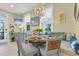 Charming dining area with banquette seating, glass table, and elegant chandelier at 3271 Johnstowne St, Johns Island, SC 29455