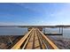 A wooden walkway to the water, perfect for fishing or launching a boat at 3271 Johnstowne St, Johns Island, SC 29455