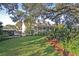 Charming two-story home with a well-manicured front lawn and mature trees in a peaceful setting at 3271 Johnstowne St, Johns Island, SC 29455
