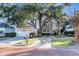Inviting home featuring a matching detached garage and well-manicured lawn and brick-paved street at 3271 Johnstowne St, Johns Island, SC 29455