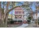 Charming two-story home with a welcoming front porch and beautiful mature trees at 3271 Johnstowne St, Johns Island, SC 29455