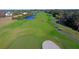 Lush green golf course with sand trap and view of homes in the distance at 3271 Johnstowne St, Johns Island, SC 29455