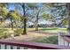 Scenic view of the golf course with lush green grass and mature trees under a clear blue sky at 3271 Johnstowne St, Johns Island, SC 29455