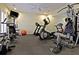 Home gym equipped with a treadmill, elliptical, stationary bike, and weight machine, offering a convenient fitness space at 3271 Johnstowne St, Johns Island, SC 29455