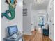 Hallway featuring a mermaid sculpture and light hardwood floors at 3271 Johnstowne St, Johns Island, SC 29455