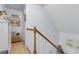 Upstairs hallway featuring carpet, a wooden handrail and beach themed decor at 3271 Johnstowne St, Johns Island, SC 29455