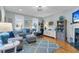 Bright living room with stylish furniture, hardwood floors, and natural light at 3271 Johnstowne St, Johns Island, SC 29455