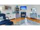 Cozy living room featuring hardwood floors, a fireplace, and stylish decor at 3271 Johnstowne St, Johns Island, SC 29455